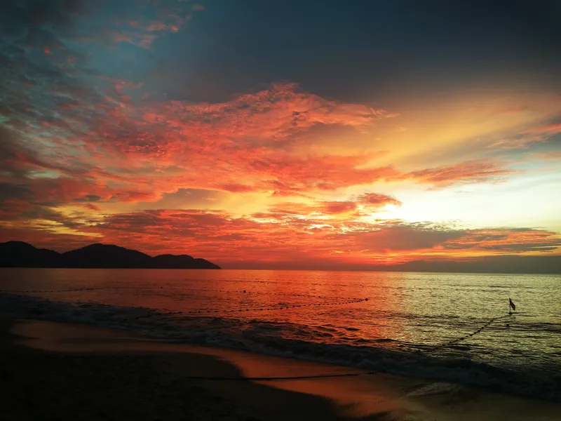 Late afternoon on Batu Ferringhi beach, looking toward the headland